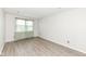 Bedroom with wood-look flooring and bright natural light at 1124 Paradise Ct # B, Greenwood, IN 46143