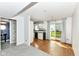 Open floorplan featuring a cozy living room with a staircase and hardwood floors leading to the kitchen at 1124 Paradise Ct # B, Greenwood, IN 46143