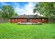 Large backyard with a spacious lawn, ideal for outdoor activities and gardening, with a deck at 11630 Deanna Dr, Indianapolis, IN 46229