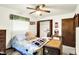 Inviting bedroom featuring natural light, neutral walls, closet, and a vintage trunk at 11630 Deanna Dr, Indianapolis, IN 46229