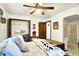 Cozy bedroom with a ceiling fan, closet, and connected bathroom for convenient living at 11630 Deanna Dr, Indianapolis, IN 46229