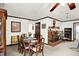 Spacious dining room showcases a fireplace and a large table perfect for gatherings at 11630 Deanna Dr, Indianapolis, IN 46229