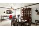 Large dining room includes a dark wood table, seating for eight, and decorative china cabinet at 11630 Deanna Dr, Indianapolis, IN 46229