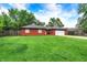 Beautiful brick home with green lawn, mature trees, and an attached two-car garage at 11630 Deanna Dr, Indianapolis, IN 46229