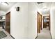 Hallway leads to various rooms with doors and neutral decor, offering a sense of flow and connection at 11630 Deanna Dr, Indianapolis, IN 46229