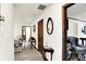 Bright hallway featuring vintage decor and access to the living room at 11630 Deanna Dr, Indianapolis, IN 46229