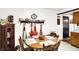 Cozy kitchen corner shows a wooden table with chairs, vintage decorations, and tiled backsplash at 11630 Deanna Dr, Indianapolis, IN 46229