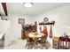 Bright kitchen with tiled walls, white appliances, a round dining table, and vintage décor at 11630 Deanna Dr, Indianapolis, IN 46229