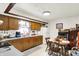 Charming eat-in kitchen features wood cabinets, white appliances, and a cozy dining area at 11630 Deanna Dr, Indianapolis, IN 46229