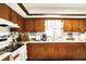 Well-maintained kitchen featuring classic wooden cabinets and functional appliances at 11630 Deanna Dr, Indianapolis, IN 46229