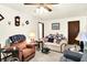 Cozy and charming living room with comfortable seating, vintage decor and warm lighting at 11630 Deanna Dr, Indianapolis, IN 46229