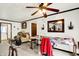 Bright room featuring ceiling fan, and a large sewing table with a large sliding glass door for natural lighting at 11630 Deanna Dr, Indianapolis, IN 46229