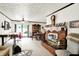Open-concept living area with fireplace, dining set, and ample natural light, creating a welcoming atmosphere at 11630 Deanna Dr, Indianapolis, IN 46229