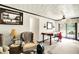 Comfortable living room with cozy chair and a large sliding glass door for natural lighting and backyard views at 11630 Deanna Dr, Indianapolis, IN 46229