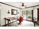 Bright room featuring ceiling fan, and a large sewing table with a large sliding glass door for natural lighting at 11630 Deanna Dr, Indianapolis, IN 46229