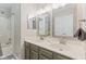 This bathroom features a dual sink vanity, modern fixtures, and combined shower and tub at 12043 Searay Dr, Indianapolis, IN 46236