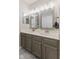 The bathroom features a dual sink vanity with modern fixtures, and clean lines at 12043 Searay Dr, Indianapolis, IN 46236