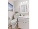 Clean half-bathroom featuring modern fixtures, a white vanity, and ample lighting at 12043 Searay Dr, Indianapolis, IN 46236