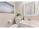 Well-lit half-bath with modern fixtures, a decorative painting, and a clean design at 12043 Searay Dr, Indianapolis, IN 46236