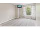 A bright bedroom is equipped with hardwood floors, and a wall-mounted television at 12043 Searay Dr, Indianapolis, IN 46236