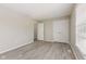 A spacious bedroom boasts hardwood floors, ample closet space, and natural lighting at 12043 Searay Dr, Indianapolis, IN 46236