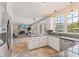 Bright kitchen featuring granite countertops, stainless steel appliances, and a view to the living area at 12043 Searay Dr, Indianapolis, IN 46236