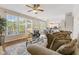 Inviting living room with large windows, a comfortable sofa, and an open floor plan at 12043 Searay Dr, Indianapolis, IN 46236