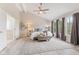 Spacious main bedroom with vaulted ceiling, hardwood floors, and large windows at 12043 Searay Dr, Indianapolis, IN 46236