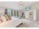 Bright main bedroom with a vaulted ceiling, hardwood floors, and a large bed at 12043 Searay Dr, Indianapolis, IN 46236