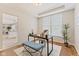 Well-lit home office with tray ceilings, a large window, and a comfortable workspace for productivity at 12043 Searay Dr, Indianapolis, IN 46236
