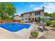 Backyard featuring a refreshing in-ground pool, complete with lounge chairs and manicured landscaping, perfect for relaxation at 12043 Searay Dr, Indianapolis, IN 46236