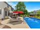 This home has a beautiful outdoor pool with lounge chairs for relaxing on sunny days at 12043 Searay Dr, Indianapolis, IN 46236