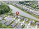 Beautiful aerial view of suburban homes surrounding a tranquil lake and lush green spaces. A perfect neighborhood for families! at 12105 Fall Ct, Indianapolis, IN 46229