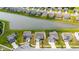 Aerial view of homes in a community next to a peaceful pond with well-manicured lawns at 12105 Fall Ct, Indianapolis, IN 46229
