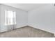 Empty bedroom featuring window with light filtering shades and neutral carpet at 12105 Fall Ct, Indianapolis, IN 46229