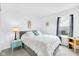 Cozy bedroom with a comfortable bed, decorative dream catcher, and a sunny window view at 12105 Fall Ct, Indianapolis, IN 46229