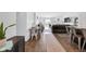 Bright open-concept living space featuring wood floors and a dining table at 12105 Fall Ct, Indianapolis, IN 46229
