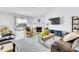 Bright living room features fireplace, TV, lake view, and comfortable seating at 12105 Fall Ct, Indianapolis, IN 46229