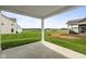 A spacious backyard features a large green space and a concrete patio at 12500 Morning Ridge Way, Noblesville, IN 46060
