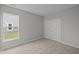 Comfortable bedroom with neutral carpet, a large window and a double-door closet at 12500 Morning Ridge Way, Noblesville, IN 46060