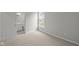 Bright bedroom with neutral carpet, gray walls, and natural light from a window at 12500 Morning Ridge Way, Noblesville, IN 46060