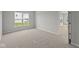 Bedroom with plush neutral carpet, light paint and a large window for natural light at 12500 Morning Ridge Way, Noblesville, IN 46060
