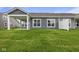 A home's rear elevation featuring green grass and blue siding at 12500 Morning Ridge Way, Noblesville, IN 46060