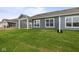 A home's rear elevation featuring green grass and blue siding at 12500 Morning Ridge Way, Noblesville, IN 46060