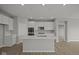 Modern kitchen with white cabinets, a spacious island, stainless steel appliances, and sleek countertops at 12500 Morning Ridge Way, Noblesville, IN 46060