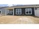 Backyard with a dark-colored exterior, white trim and a porch featuring a white beam and post at 12516 Morning Ridge Way, Noblesville, IN 46060