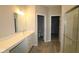 Bathroom featuring a vanity with white countertops, tile flooring, and a glass-enclosed shower at 12516 Morning Ridge Way, Noblesville, IN 46060