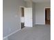 Cozy bedroom with neutral walls, plush carpet, and doorways leading to other rooms in the home, creating a comfortable atmosphere at 12516 Morning Ridge Way, Noblesville, IN 46060