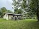 View of the backyard and deck area, perfect for outdoor entertaining and relaxing near mature trees at , Indianapolis, IN 46241