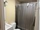 Bathroom featuring tiled shower, with a gray shower curtain, a toilet, and a white vanity at , Indianapolis, IN 46241